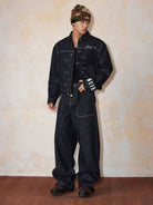 MEDM Embroidered Cuff Raw Denim Jacket in Blue - On Male Model