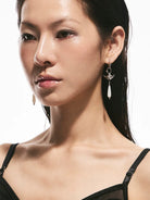BLACKHEAD Manta Ray Mother of Pearl Drop Earrings in Silver - On Female Model