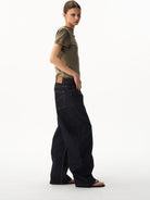 BLINDNOPLAN Curved Wide Leg Raw Denim Jeans in Denim - On Female Model