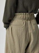 SIMPLE PROJECT Lyocell Blend Curved Leg Trousers in Mint - On Model