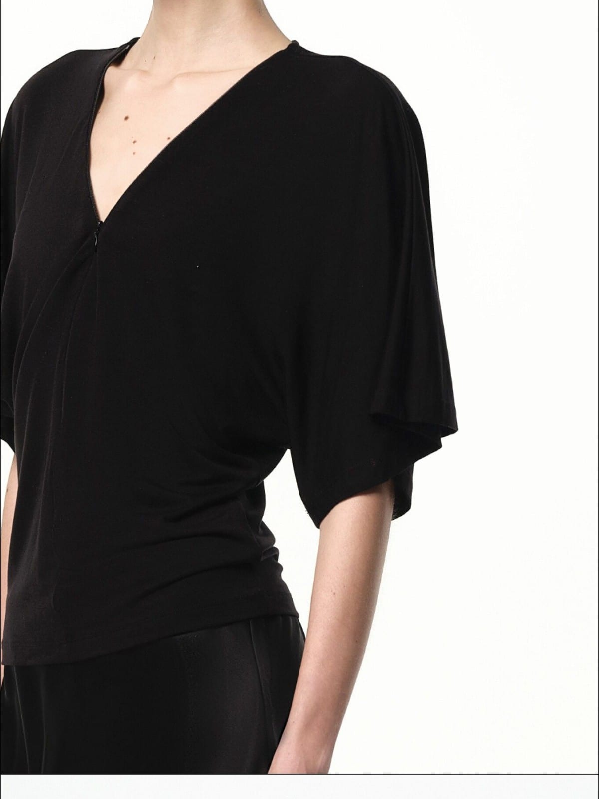 RARELY ALIKE Lyocell V Neck Batwing Sleeve Top in Black - On Female Model