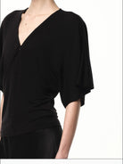 RARELY ALIKE Lyocell V Neck Batwing Sleeve Top in Black - On Female Model