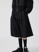 SIMPLE PROJECT Cotton Pleated Cropped Shorts in Black - On Male Model