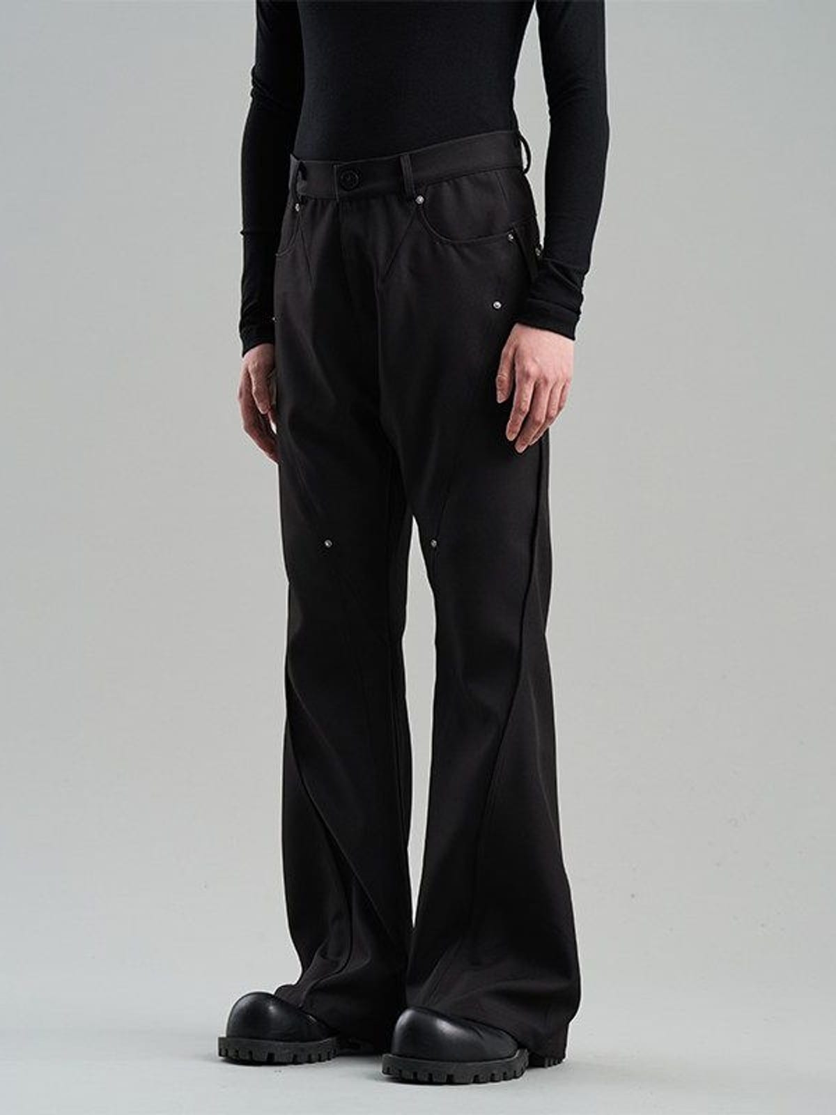 BLINDNOPLAN Diagonal Paneled Trousers with Rivets in Black - On Model