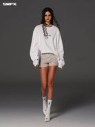 SMFK Stretch Cotton Denim Shorts in Beige - On Female Model