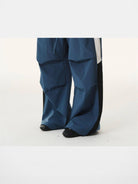 BLINDNOPLAN Contrast Panel Pleated Parachute Pants in Blue - On Model
