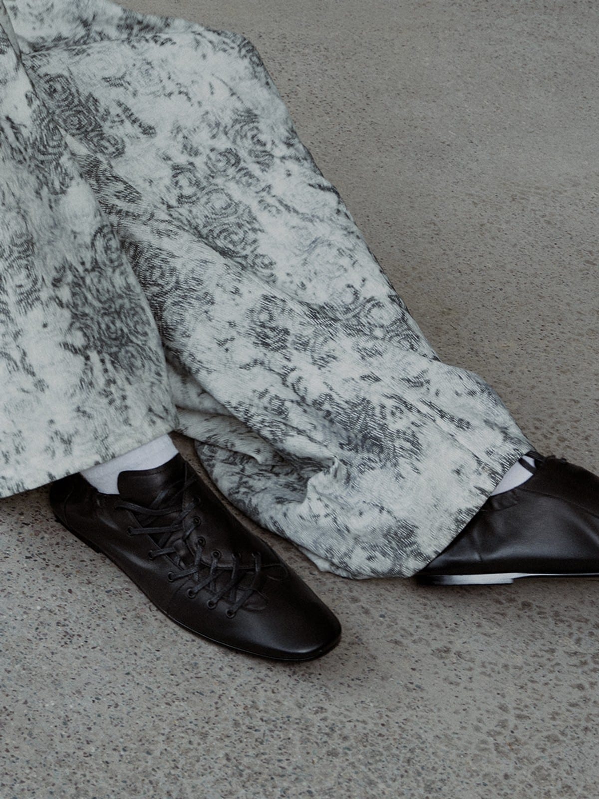 JCAESAR STUDIO Ruched Asymmetrical Leather Sneakers in Black - On Model