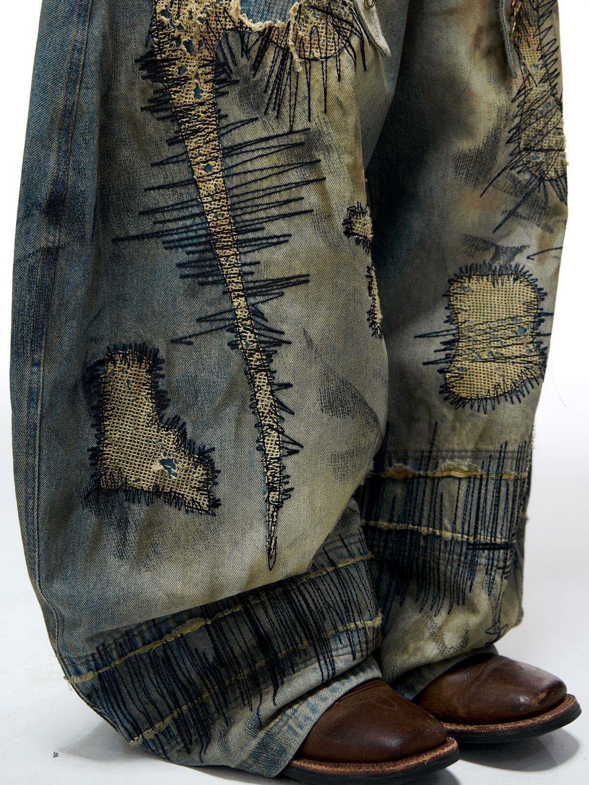 PERSONSOUL Stained Wash Embroidered Curved Jeans in Denim - On Model
