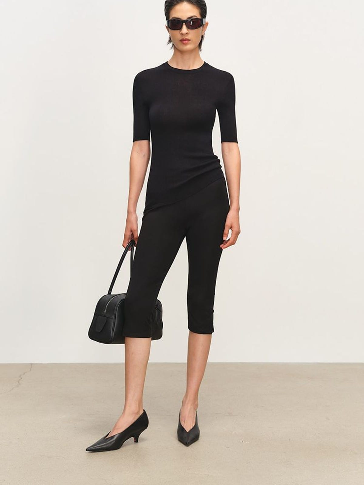 MSBEAST Viscose Blend Capri Leggings in Black - On Female Model