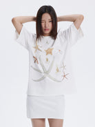 THELIGHT OFFICIAL Rhinestone Starfish Motif T Shirt in White - On Female Model