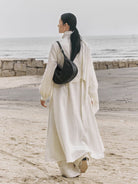 QIUZHEN Vegetable Tanned Leather Crescent Bag in Black - On Female Model