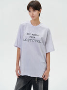 LOSTCTRL Cross Stitch Letter T Shirt in Sky Blue - On Female Model