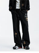 MEDM Leopard Leather Patch Drawstring Pants in Black - On Model