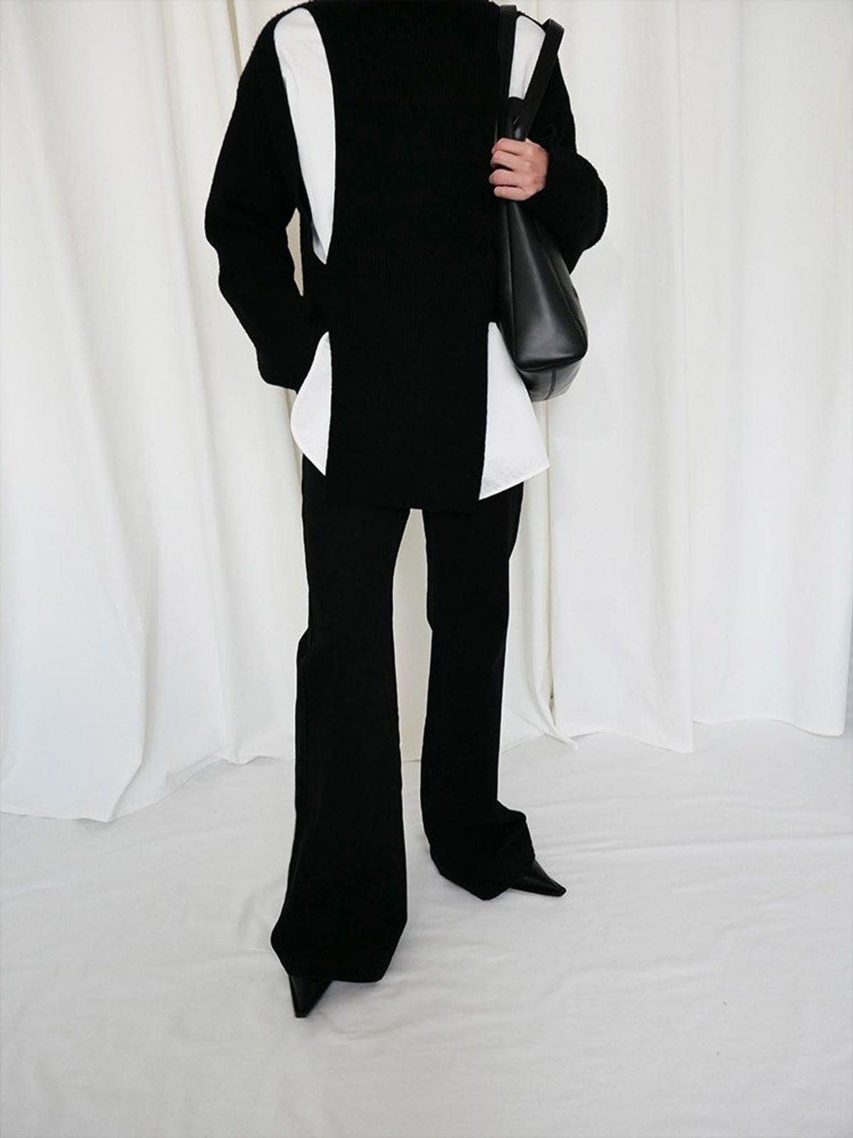 RARELY ALIKE Curved Seam Denim Flare Jeans in Black - On Model
