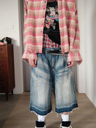UNKNOWNWORLD Distressed Wash Baggy Shorts in Blue - On Male Model