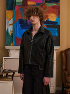 Retro 21 Padded Faux Leather Jacket in Black - On Male Model
