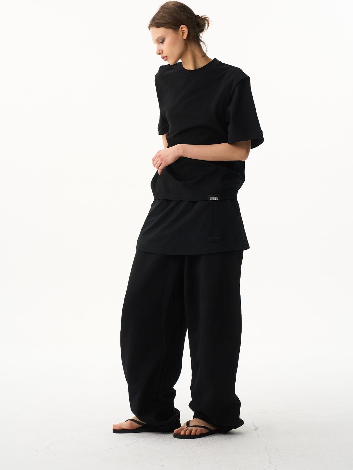 BLINDNOPLAN Layered Cotton Blend Sweatpants in Black - On Female Model