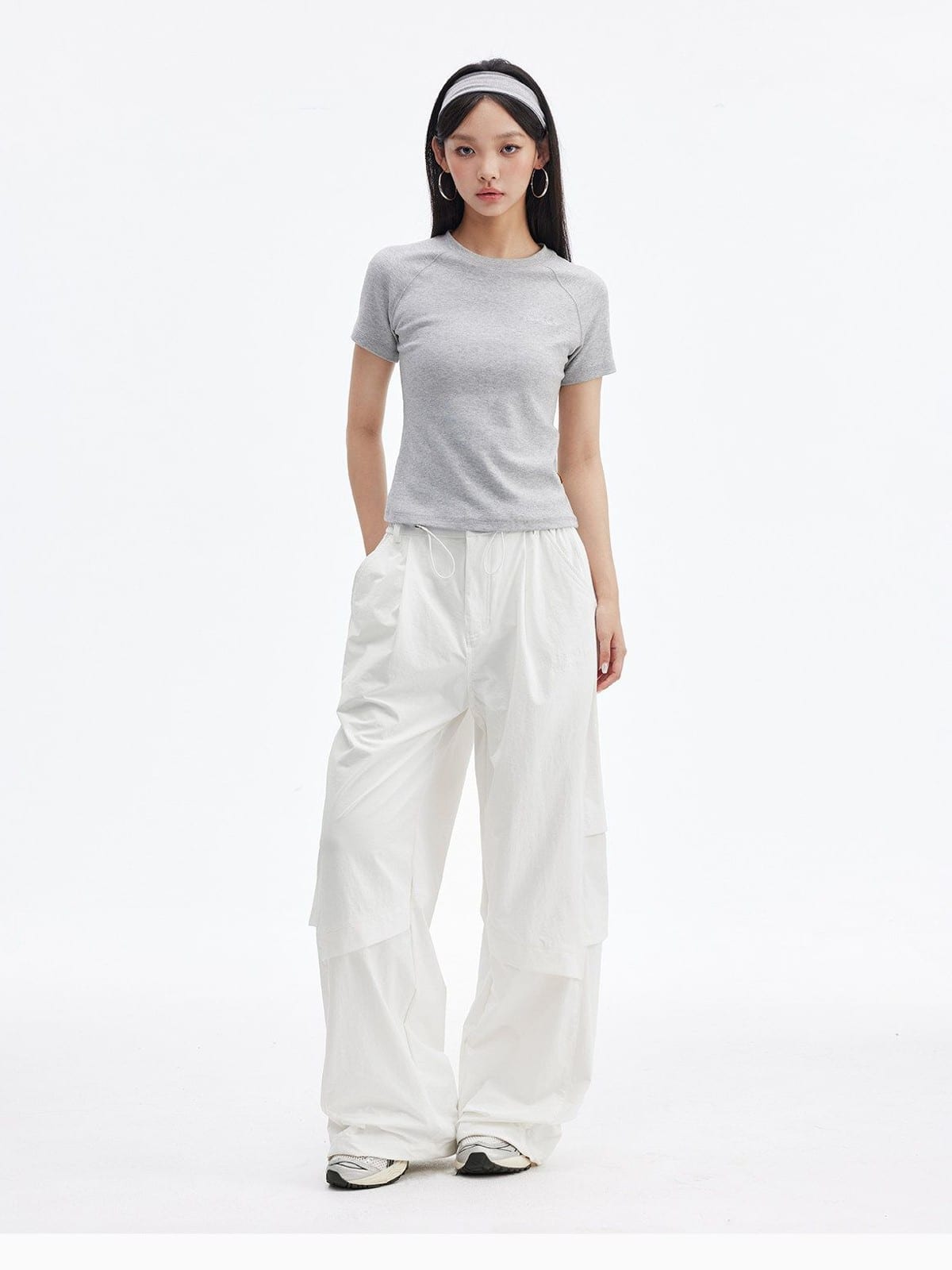 MEDM Crinkled Nylon Parachute Cargo Pants in White - On Female Model