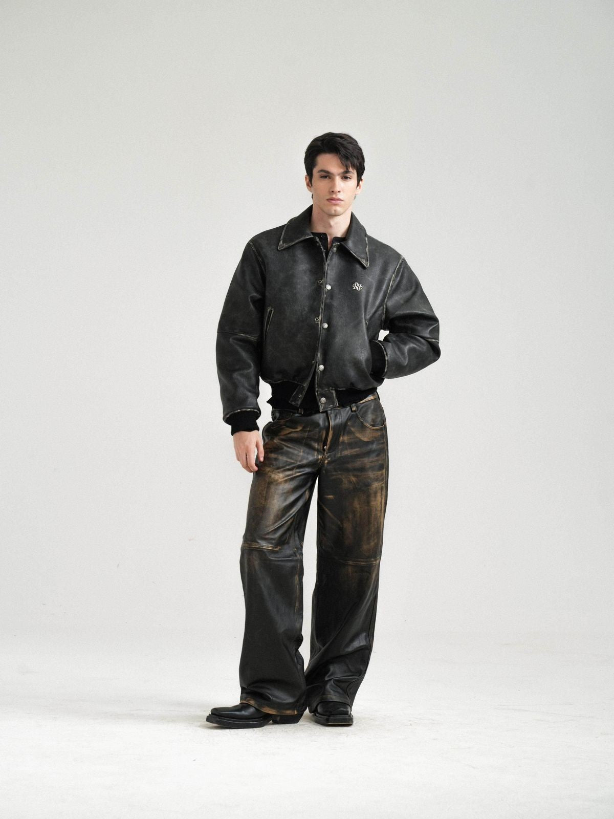 Retro 21 Distressed Faux Leather Padded Jacket in Black - On Male Model