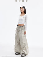 MEDM Multi Pocket Parachute Cargo Pants in Gray - On Female Model