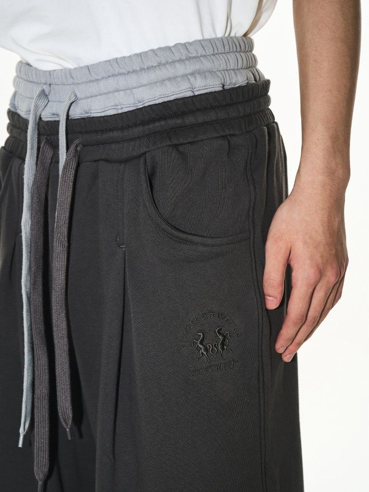 BLINDNOPLAN Double Waistband Pleated Sweatpants in Dark Gray - On Male Model