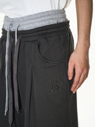 BLINDNOPLAN Double Waistband Pleated Sweatpants in Dark Gray - On Male Model