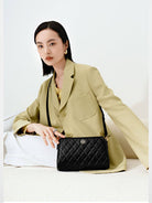 HONGU Quilted Leather Chain Crossbody Bag in Black - On Female Model