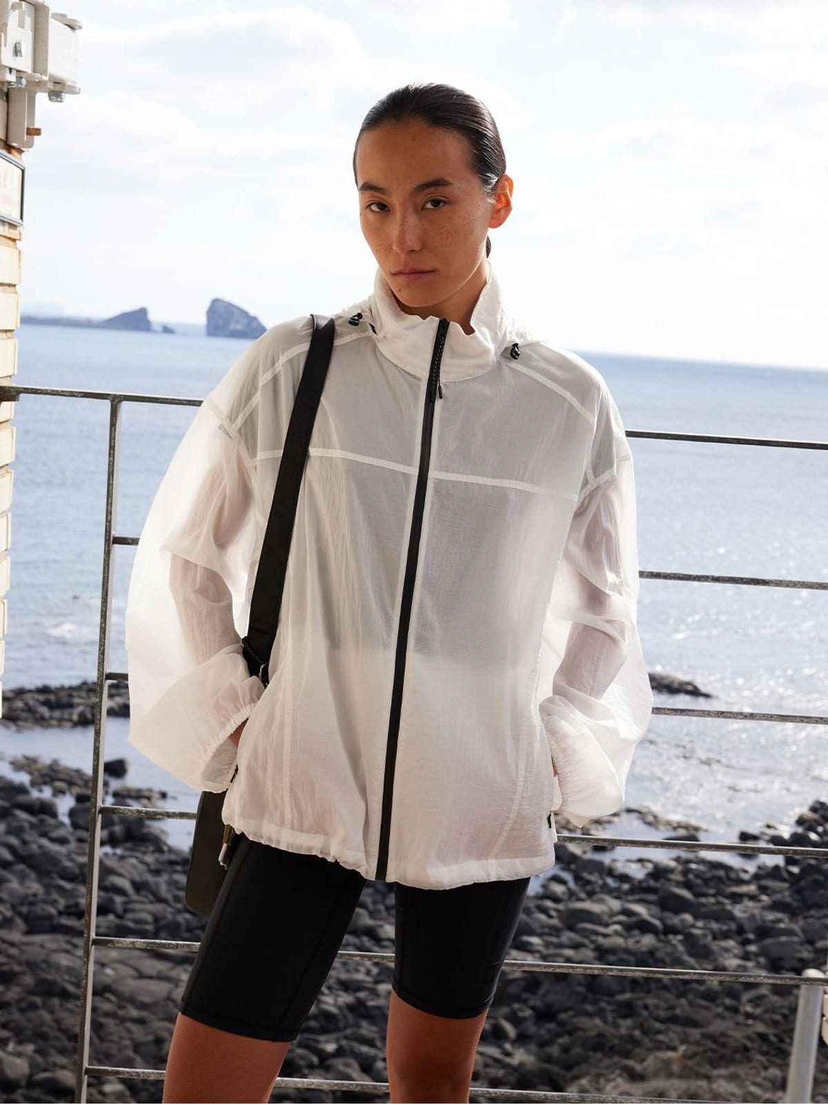 Random Piece Lightweight Cropped Hooded Nylon Jacket in White - On Female Model