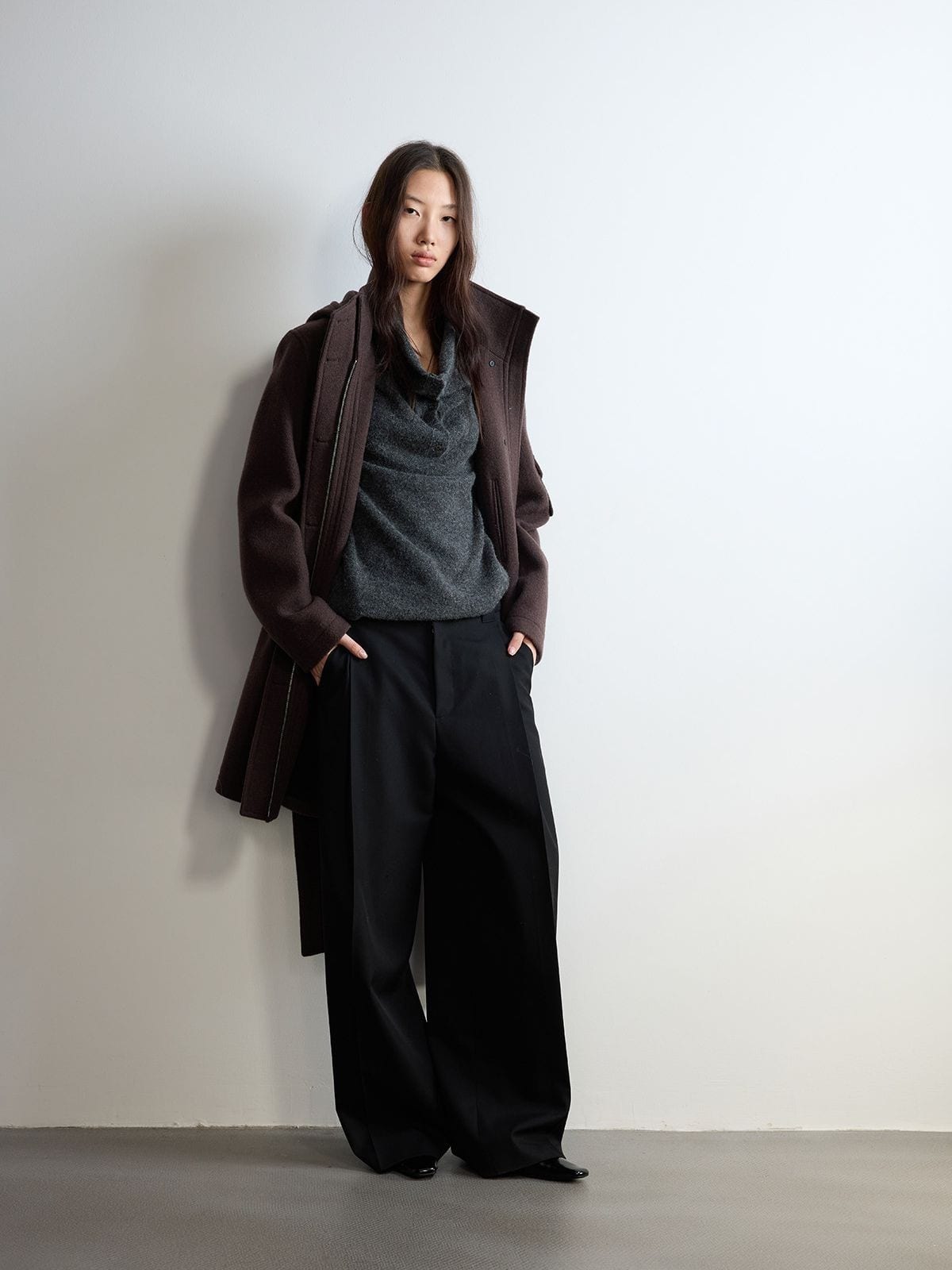Random Piece Pleated Merino Wool Wide Leg Trousers in Black - On Female Model