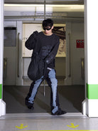 TRIANGLE PROJECT Deconstructed Patchwork Micro Flare Jeans in Black - On Male Model