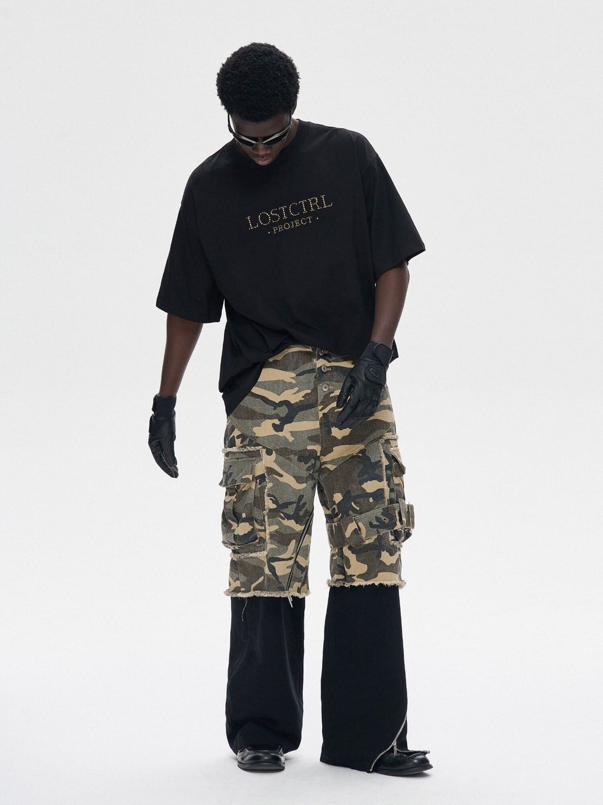 LOSTCTRL Heavyweight Cotton Rivet Logo T Shirt in Black - On Male Model