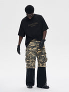 LOSTCTRL Heavyweight Cotton Rivet Logo T Shirt in Black - On Male Model
