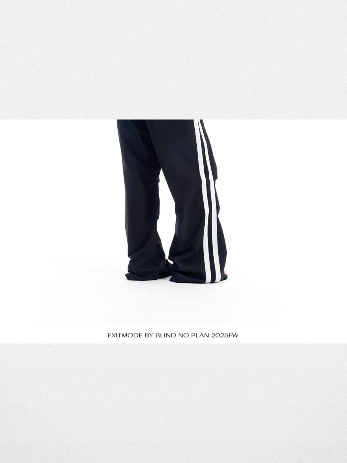 BLINDNOPLAN Striped Pleated Track Pants in Black - On Model