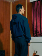 SOD Embroidered Padded Shoulder Hoodie in Blue - On Male Model