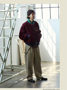 USAGE Reversible Velvet Leather Varsity Jacket in Navy Blue - On Male Model