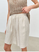 MSBEAST 100 Linen Knee Length Shorts in Beige - On Female Model