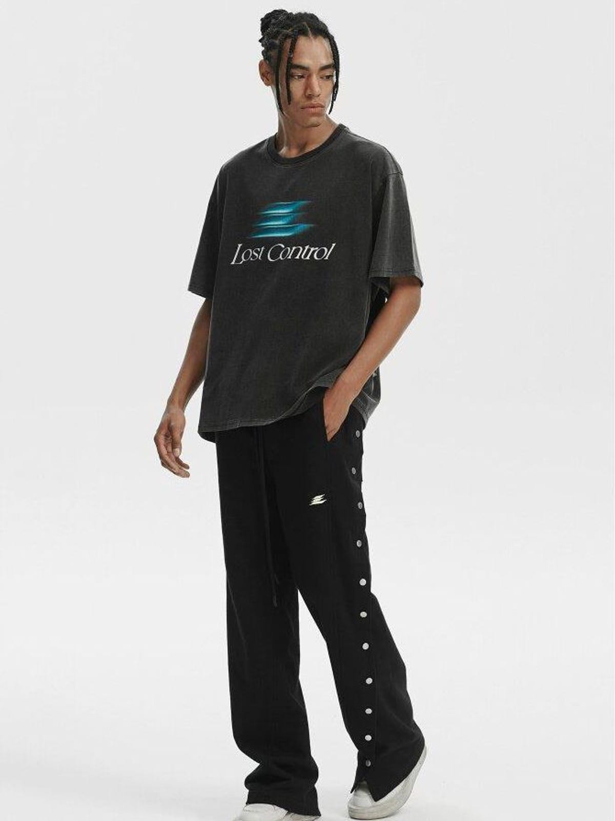 LOSTCTRL Asymmetrical Snap Button Cotton Pants in Black - On Male Model
