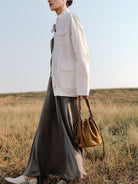QIUZHEN Kidskin Drawstring Bucket Bag in Brown - On Female Model