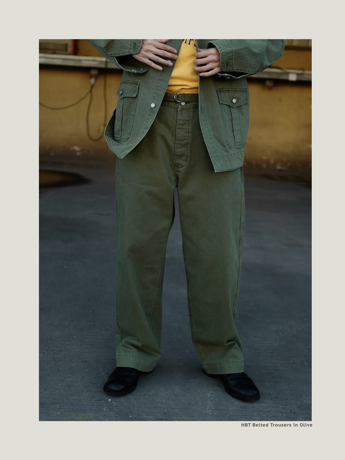 USAGE Heavyweight Herringbone Twill Belted Trousers in Olive - On Male Model