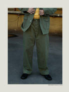 USAGE Heavyweight Herringbone Twill Belted Trousers in Olive - On Male Model
