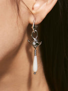 BLACKHEAD Manta Ray Mother of Pearl Drop Earrings in Silver - On Female Model