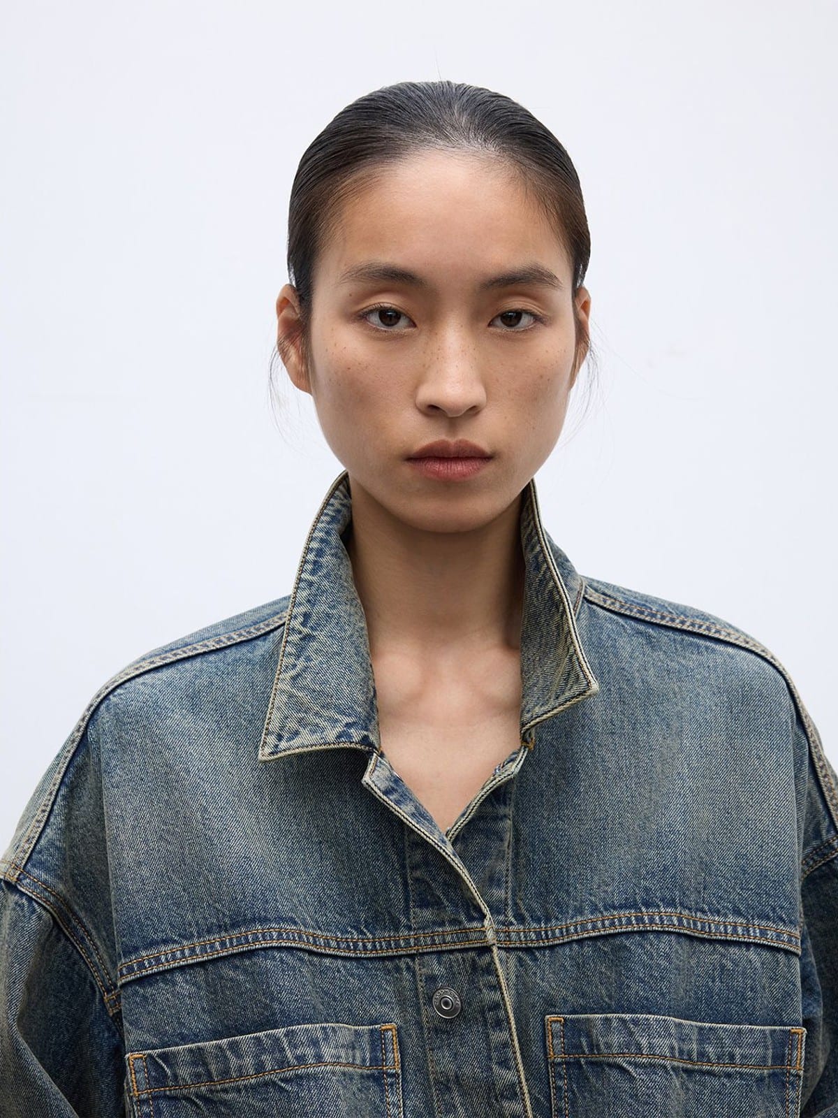 Random Piece Washed Cotton Cropped Denim Jacket in Denim - On Female Model