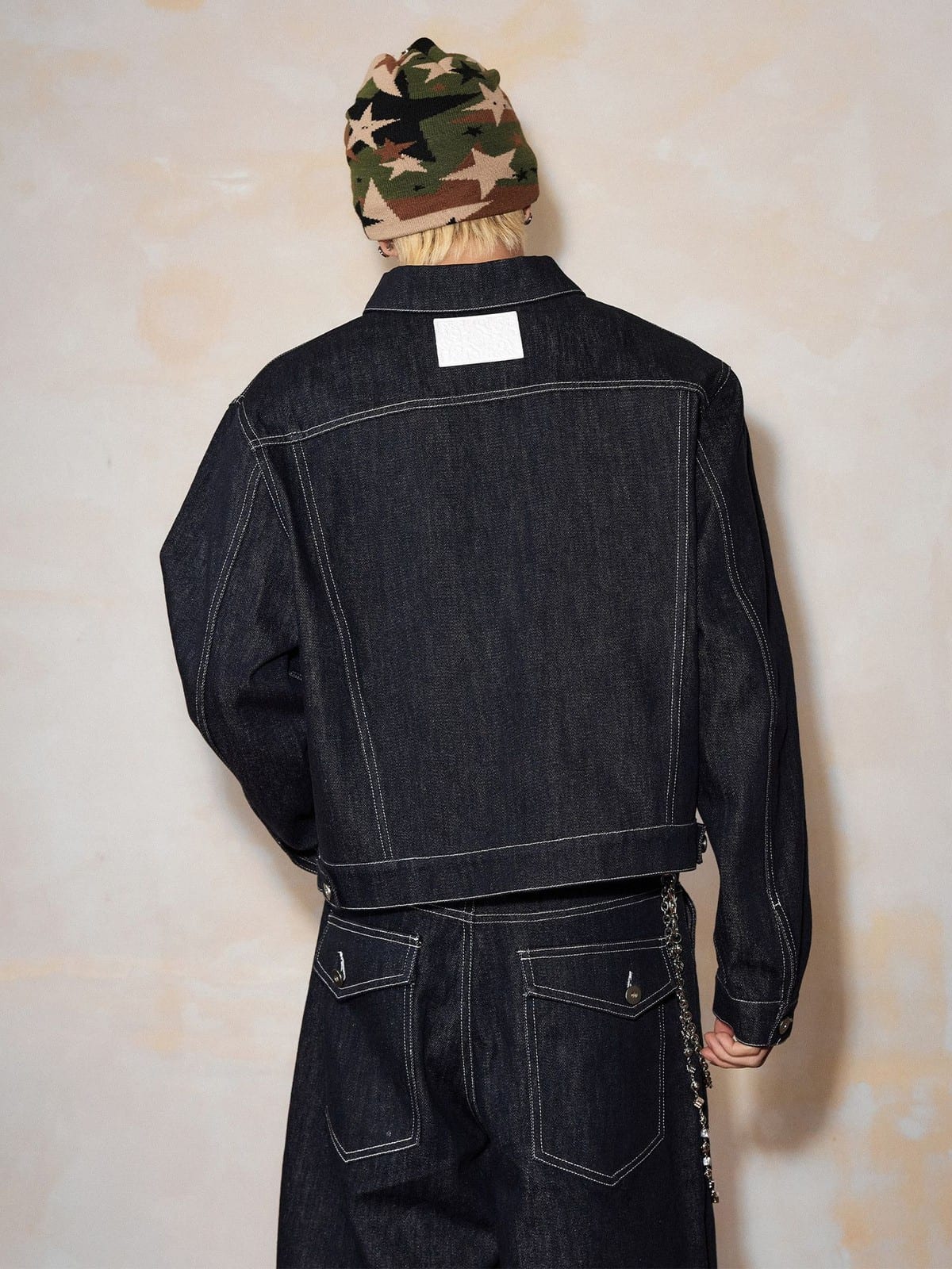 MEDM Embroidered Cuff Raw Denim Jacket in Blue - On Model