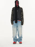 BLINDNOPLAN Paneled Embroidered Distressed Denim Pants in Blue - On Model