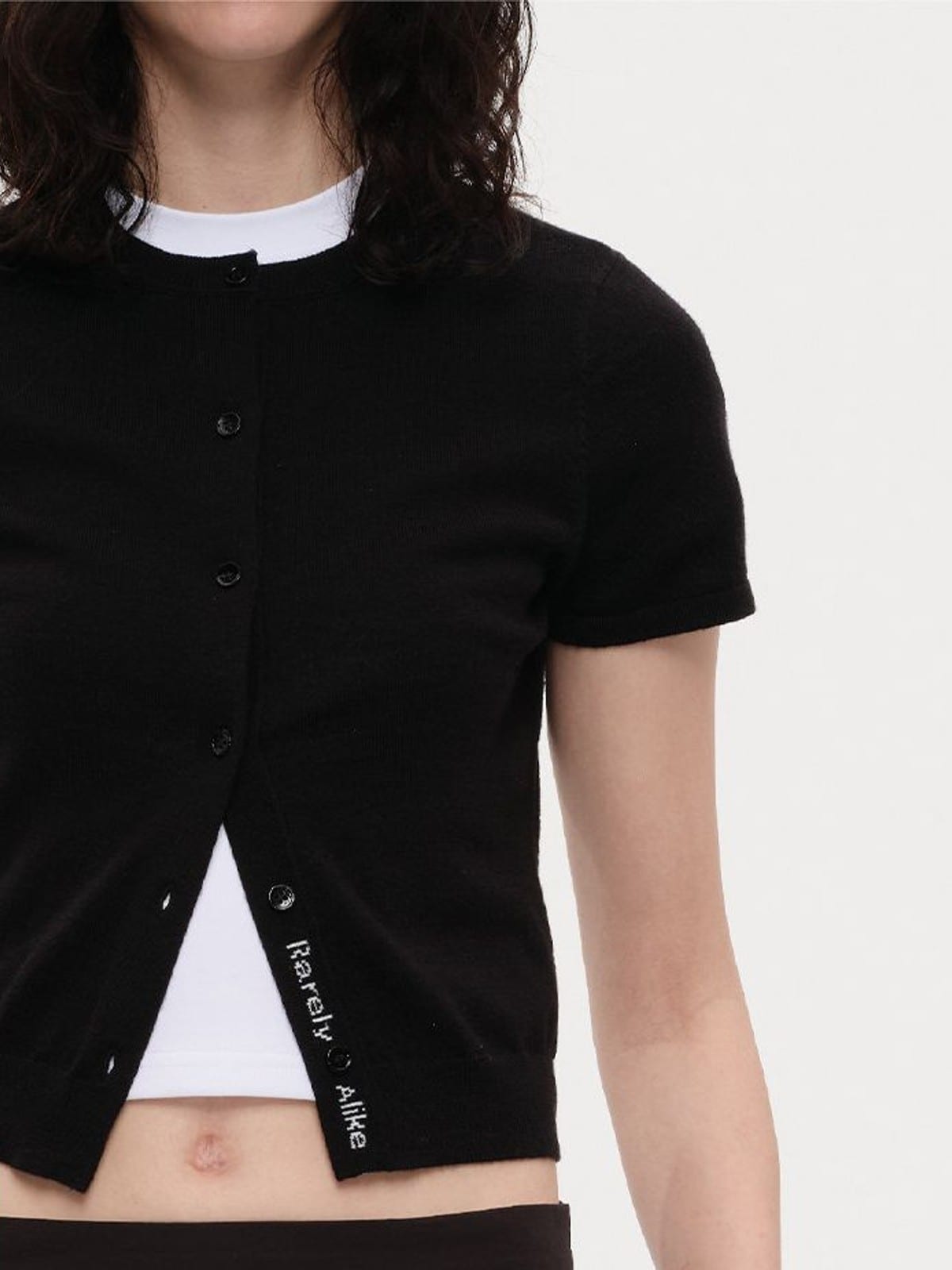 RARELY ALIKE Pure Wool Short Sleeve Cardigan in Black - On Female Model