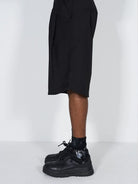 BLINDNOPLAN Asymmetric Striped Suit Shorts in Black - On Model