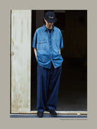 USAGE Distressed Short Sleeve Denim Shirt in Denim - On Male Model