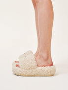 SMFK Cross Motif Faux Fur Platform Slides in White - On Model