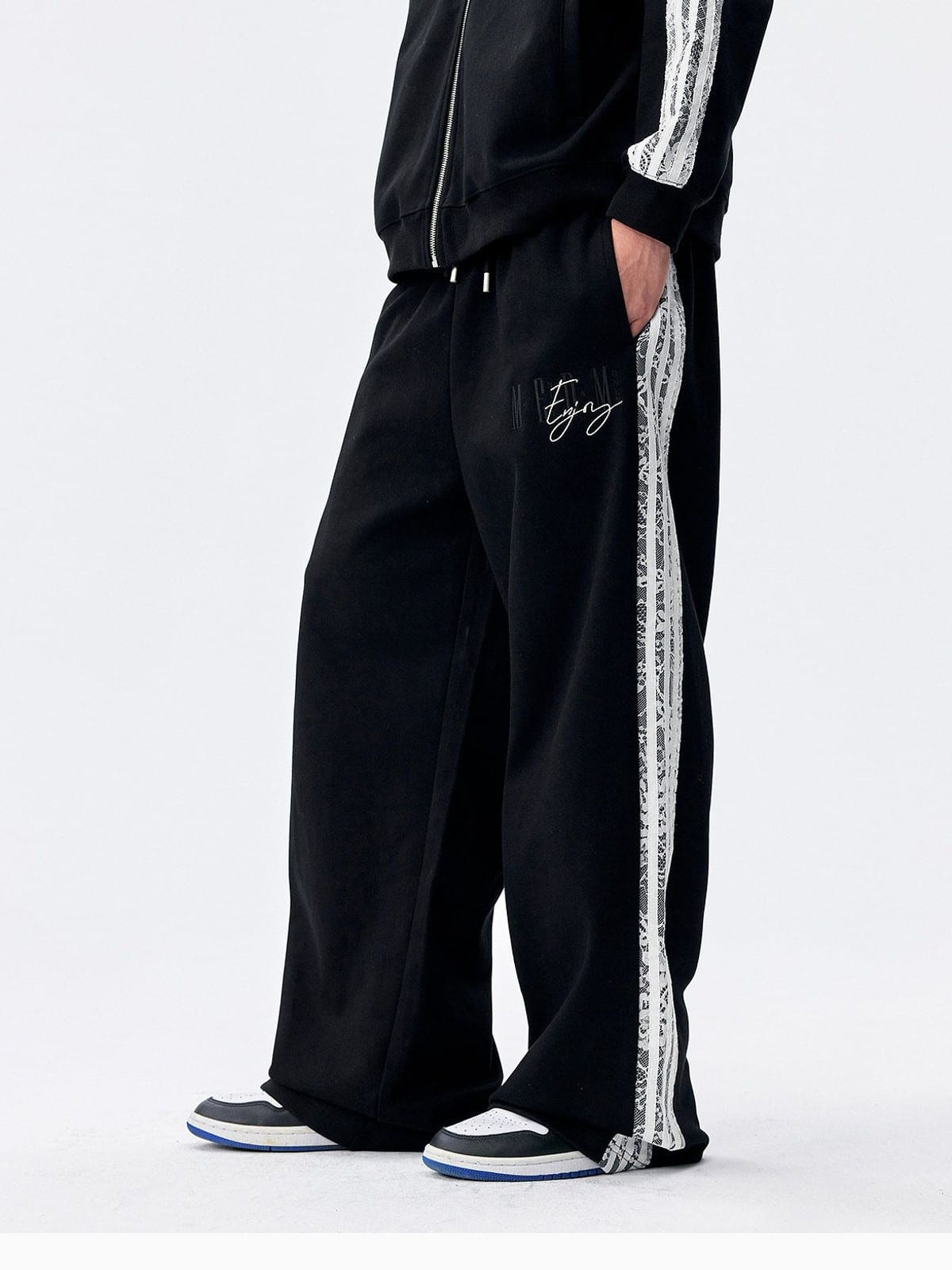 MEDM Lace Paneled Striped Track Pants in Black - On Model