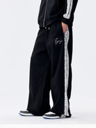 MEDM Lace Paneled Striped Track Pants in Black - On Model